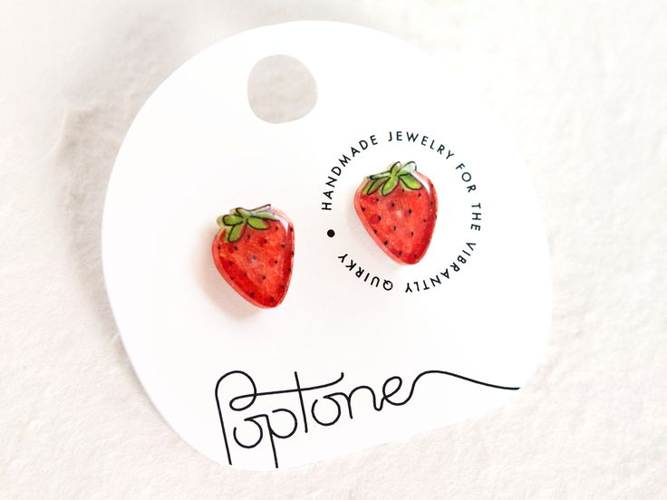 🍓 Nothing says "summer" like biting into a delicious red strawberry, and these bright red strawberry earrings add the perfect touch to a cute summer outfit. 🙌 Each earring is handmade and hand-illustrated, ensuring that no two are exactly alike. The earrings are coated in glossy resin and made with super hypoallergenic nickel-free titanium earring posts - perfect for people with metal sensitivities! 💧 These earrings are highly water resistant, but please care for them by removing before showe Summer Gift Cherry Earrings, Cute Red Earrings With Fruit Design, Trendy Watermelon Colored Earrings For Gift, Casual Summer Earrings For Gifts, Cute Red Strawberry Print Earrings, Cute Strawberry Print Earrings For Gifts, Earrings Strawberry, Strawberry Earrings, Kawaii Fruit