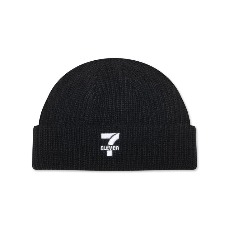 Black beanie with white 7-Eleven logo on front. Trendy Beanie For Spring Streetwear, Fall Streetwear Beanie With Ribbed Cuffs, Trendy Spring Beanie For Streetwear, Casual Knitted Beanie For Streetwear, Trendy Streetwear Beanie For Spring, Trendy Spring Streetwear Beanie, Spring Streetwear Casual Beanie, Casual Spring Streetwear Beanie, Casual Beanie For Fall Streetwear