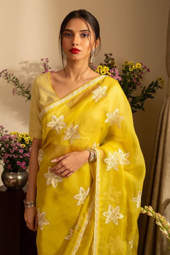 Lemon yellow saree crafted in pure silk organza with phool embroidery. Paired with an unstitched blouse piece and an unstitched petticoat. - Aza Fashions Gold Traditional Wear With Chikankari Embroidery In Organza, Yellow Organza Sets With Chikankari Embroidery, Yellow Tissue Silk Saree With Chikankari Embroidery, Yellow Semi-stitched Chikankari Pre-draped Saree, Yellow Resham Embroidered Blouse For Eid, Chikankari Embroidery Organza Saree For Eid, Yellow Tissue Silk Blouse Piece For Eid, Yellow Chikankari Embroidery Saree For Wedding, Festive Organza Saree With Chikankari Embroidery