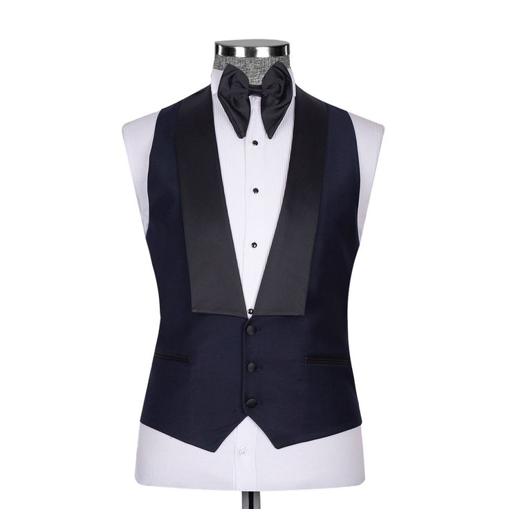 Package Includes: 1 x Jacket - 1 x Waistcoat - 1 x Pant

Upgrade your formal attire with our Dark Navy Blue Tuxedo, a blend of modern style and classic refinement. Expertly tailored for a flattering fit, this tuxedo promises both comfort and a sleek silhouette. The deep navy color adds a contemporary flair to the traditional black, ideal for weddings, galas, and any elegant affair. Constructed from high-quality fabrics, it features a satin shawl lapel and coordinated trousers, radiating luxury and elegance.

 	Fabric: 120s 
 	Lining Fabric: Silk
 	Pattern: Plain
 	Buttons: Black Fabric
 	Construction: Half Canvas
 	Seasonality: All Season
 	Jacket: Peak Lapel, 2 Flap Pockets, Single Button Closure
 	Waistcoat: Shawl Lapel 3 Buttons Closure
 	Trouser: Grey Flat front, 2 Back Pockets, Zip Cl Elegant Fitted Outerwear For Black-tie Events, Blue Fitted Suit For Black-tie Events, Elegant Fitted Blue Tuxedo, Elegant Blue Fitted Tuxedo, Fitted Blue Tuxedo For Black-tie Events, Dapper Tuxedo With Notch Lapel For Formal Work, Dapper Tuxedo With Notch Lapel For Work, Luxury Blue Suits For Black-tie Events, Blue Tuxedo Three-piece Suit