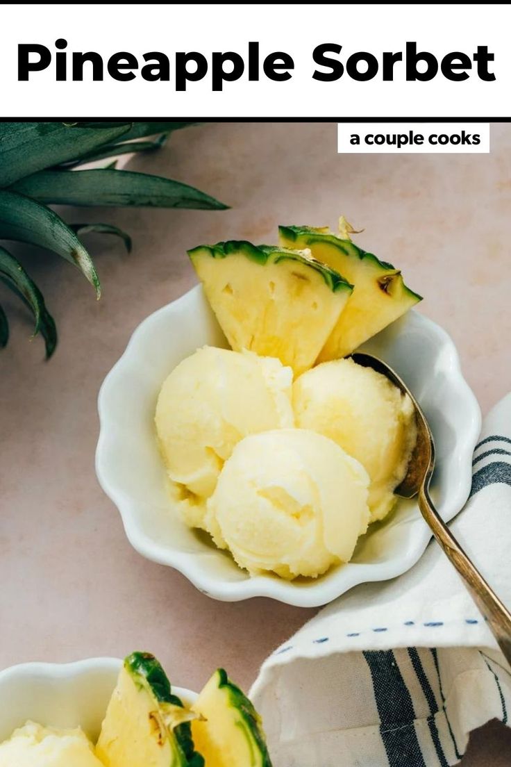 pineapple sorbet in small white bowls with spoons and towel next to it