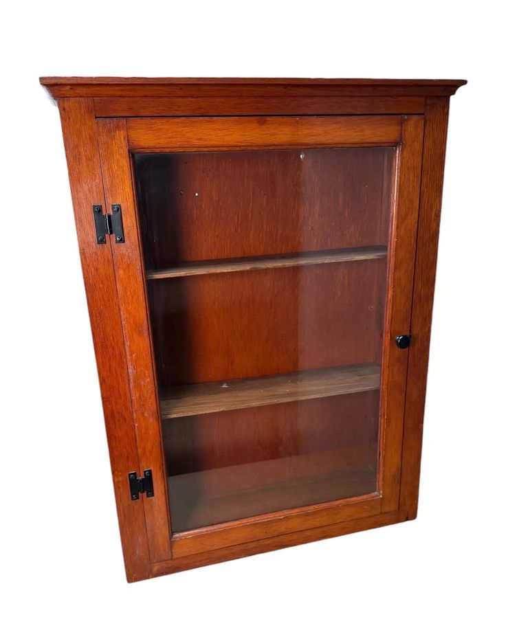 a wooden cabinet with two shelves on one side