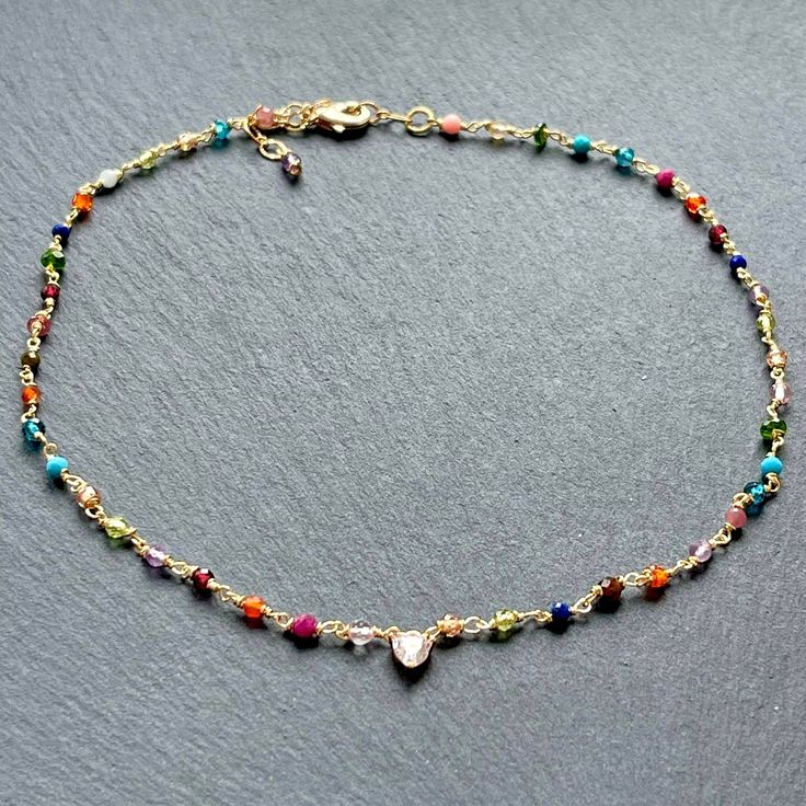 Dainty handcrafted and colorful gemstone beaded choker necklace for women which I have meticulously hand wire wrapped with rainbow colors and added an adjustable extender chain and a small central diamond heart charm in 14k gold plated. This would make cute semi precious stone Christmas gifts for your sister, teens, girls, Mother's Day or birthday jewelry gift ideas for your daughter, daughter in law, granddaughter or girlfriends. This delicate chain choker is entirely handmade by me with multip Bead Choker Necklace, Diamond Heart Necklace, Crystal Heart Pendant, Birthday Jewelry, Rainbow Gemstones, Necklace Cute, Bead Choker, Heart Necklace Diamond, Statement Choker Necklace