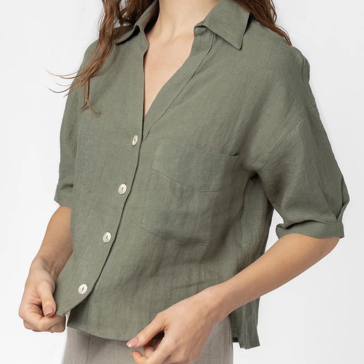 Never Worn. Lightweight Short Sleeve Shirt. The Dawn Top Features A Deep V-Neckline And Buttons Down The Front. This Style Is Perfect For Vacation And Summer Days. - 100% Linen - V-Neck - Collared Relaxed Fit V-neck Top With Button Closure, Casual Olive V-neck Top, Olive V-neck Tops For Spring, Summer Olive Tops With Relaxed Fit, Summer Olive Relaxed Fit Tops, Olive Relaxed Fit Summer Tops, Olive Tops For Summer Workwear, V-neck Tops With Button Closure And Relaxed Fit, Olive Short Sleeve Top For Summer