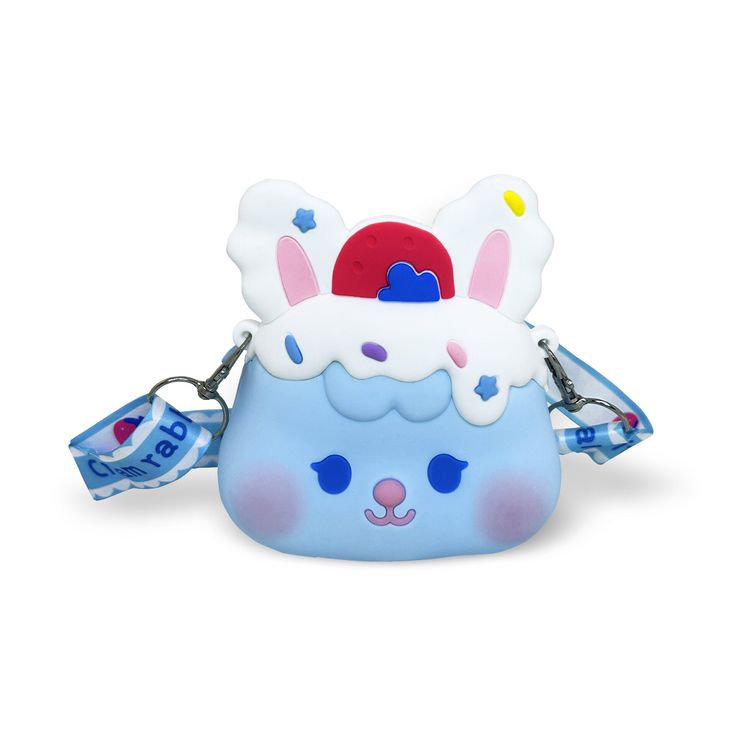 a blue and white bag with an ice cream bunny on it's face, holding two tags