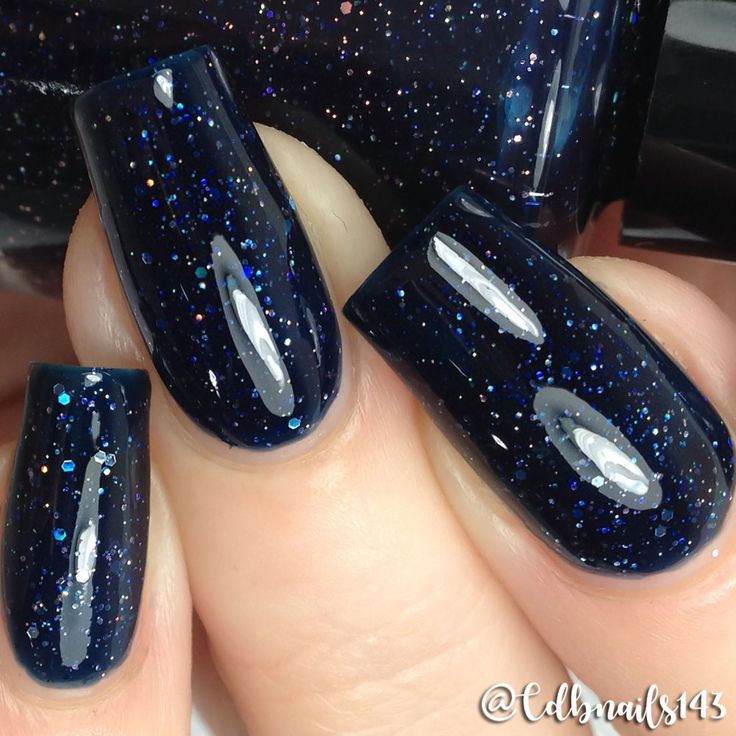 Loaded with small silver holographic glitters, this dark denim, navy jelly polish offers full coverage in 2-3 coats. Type: Jelly Base: 5-Free Glitter Load: Medium Glitter Size: Micro - Small Recommended Coats: 3 coats for full coverage depending on application style. Notes: In the bottle picture, the polish looks near black. This is a navy polish, but it is dark to allow for a deeply colored, full coverage look. For best results shake bottle gently before use and follow with a quick-dry top coat Navy Blue Shimmer Nails, Navy Jelly Nails, Dark Blue Glittery Nails, Navy Formal Nails, Dark Blue Nails With Snowflakes, Navy Blue Nails Stars, Blue Sparkle Nail Designs, Sparkly Navy Nails, Navy Blue Dip Powder Nails