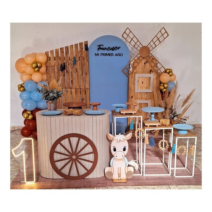 a toy horse is standing in front of a booth with balloons and other items on it