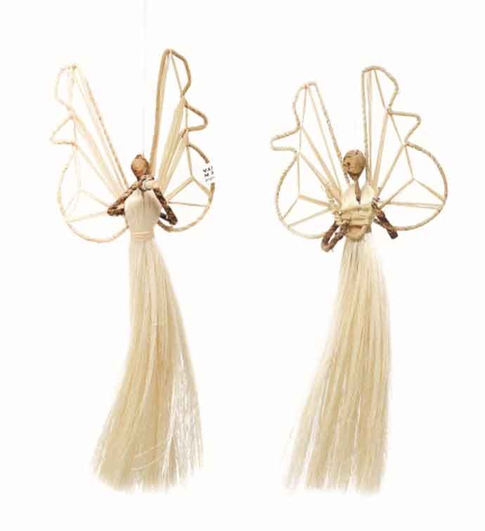 two angel ornaments hanging from strings on a white background, one with long hair and the other with wings