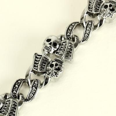 Ghastly Glam: Spook up your style with this grim glimmer of gothic grace. A vintage-inspired skeleton bracelet to die for, this macabre metallic memento mori makes a killer cryptic cuff for your creepy couture. Cast in antiqued silver and accented with a dastardly dark patina, this bony bauble is a hauntingly hip Halloween essential and morbidly marvelous statement piece. Material: Alloy Product specifications: bracelet length 20cm, width 1.5cm. Gothic Skull Print Bracelets As Gift, Silver Skull Print Bracelets As A Gift, Edgy Skull Metal Bracelets, Edgy Metal Skull Bracelets, Edgy Skull-shaped Metal Bracelets, Edgy Metal Jewelry With Skull Print, Punk Silver Skull Bracelets, Silver Skull Bracelets In Punk Style, Gothic Stainless Steel Skull Bracelets