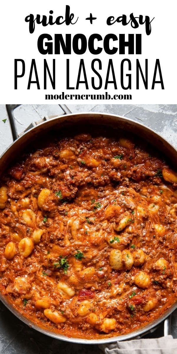 a pan filled with pasta and sauce on top of a table