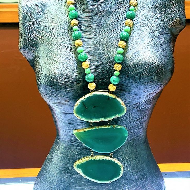 Fabulous Statement Necklace If You Feel You Can Pull Off An Iris Apfel! The Necklace Itself Consists Of Brass Beads In A Swirl Pattern Alternating With Two Sizes And Hues Of Dyed Jade Beads. The Necklace Suspends A 3-Piece Drop Of Dyed Green Chalcedony. Necklace Is 18" Length. Drop Is 5 1/2" Additional. Chalcedony Necklace, Green Chalcedony, Brass Beads, Brass Necklace, Swirl Pattern, Jade Beads, Pull Off, Womens Jewelry Necklace, Semi Precious