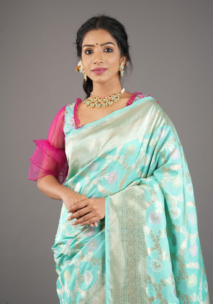 Experience regal vibes with this gorgeous Lagoon Teal Exquisite Meenakari Floral Pattern Jaal Pure Katan Silk Banarasi Saree. The intricate floral motifs in light pastel hues adorn the highest quality Katan silk material, while the pallu and border feature Zari details. And let's not forget the luxurious smoothness and glossy finish of this saree! SILK MARK CERTIFIED This saree is ready to wear with fall and pico done. Handmade silk tassels adorn the pallu and add more grace to it. An unstitched blouse fabric is included. *Note: There may be minor variations in the shade, the texture of the product. Hues/textures show differently due to variations in screen settings and other factors, *Note: This is a handwoven saree and there may be slight inconsistencies such as in it's weaving. These ar Fusion Style Pre-draped Saree With Zari Work For Diwali, Fusion Style Pre-draped Saree With Dupatta For Festive Occasions, Festive Fusion Style Pre-draped Saree With Dupatta, Festive Fusion Pre-draped Saree With Dupatta, Festive Fusion Pre-draped Saree With Cutdana, Fusion Pre-draped Saree For Wedding And Diwali, Designer Chanderi Dupatta With Tilla, Fusion Style Pre-draped Saree With Zari Work For Navratri, Eid Chandbali Pre-draped Saree