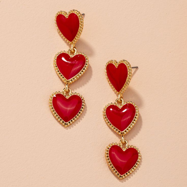 A mesmerizing pair of red and gold heart-shaped triple dangle earrings that will leave you spellbound! Lizzie Hearts, Red Heart Earrings, Retro Earrings, Beautiful Tiaras, Retro Earring, Heart Dangle Earrings, Red Jewelry, Heart Drop Earrings, Flower Hair Accessories