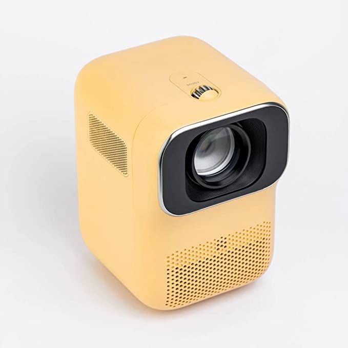 a yellow projector sitting on top of a white table