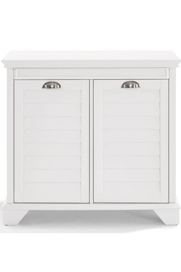 a white cabinet with two doors and drawers