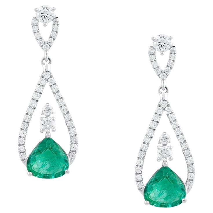 Tresor Diamond Earring features 0.70 cts diamond and 2.04 cts emerald in 18k white gold. The Earring are an ode to the luxurious yet classic beauty with sparkly diamonds. Their contemporary and modern design makes them versatile in their use. The earrings are perfect to be worn daily, at parties, music galas, charity events, conferences, and even weddings. Emerald Diamond Earrings, Charity Events, Diamond Earring, Women Accessories Jewelry, Emerald Diamond, Classic Beauty, Accessories Jewelry, Diamond Jewelry, Turquoise Necklace