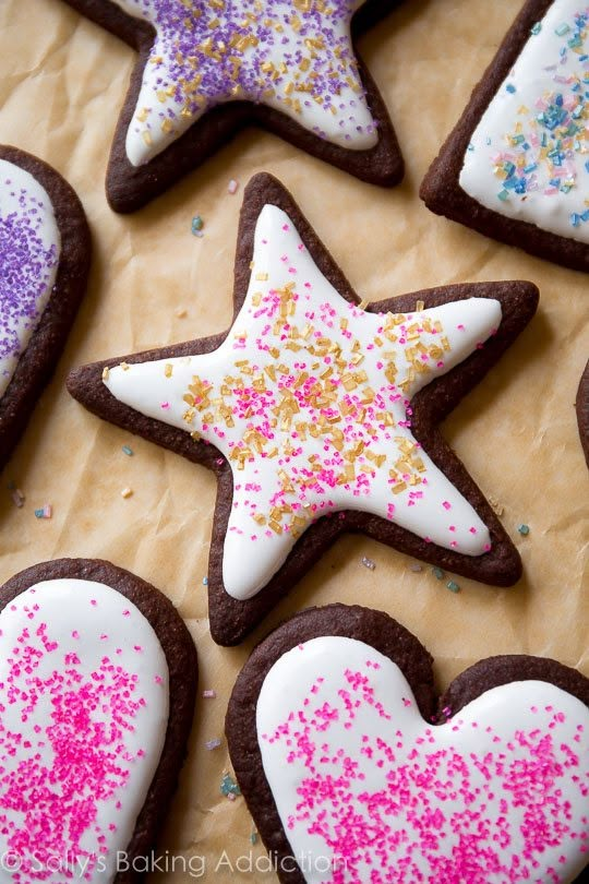 decorated cookies with sprinkles and frosting in the shape of stars