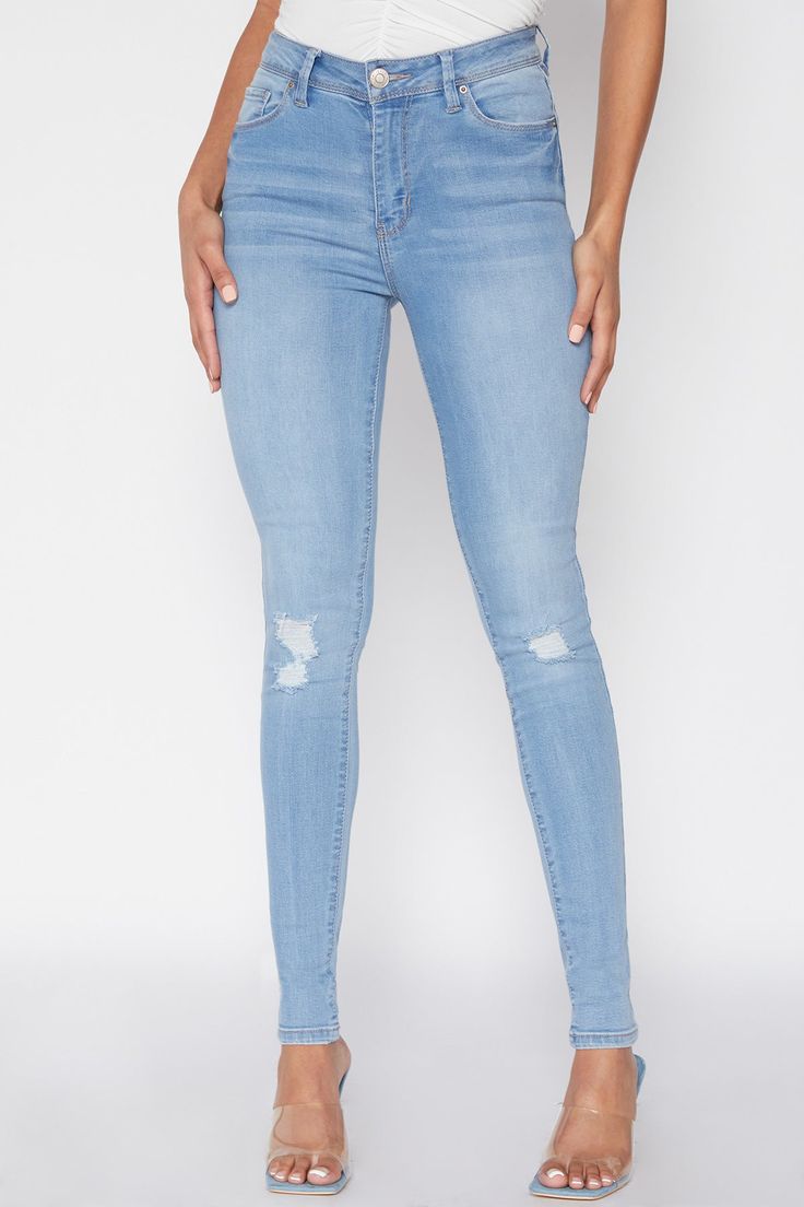 Maximize your style with our Women's Essential High Rise Skinny Ankle Jean! From their classic five pocket construction and single-button closure to their curve-hugging fit, these high-waisted denim jeans are sure to be your new favorite go-to. Style with a cropped top and tennies for a casual, sporty vibe, or with a tucked tank and heels for something sexier. Show 'em what you’re workin' with and look good doin' it! Product Details- High-Rise- Zip Fly with Single Button Closure - Belt Loops- 5-Pocket Construction- Fitted Throughout Measurement (Based on size 5)- Inseam: 30”- Rise (To top edge of band): 10”- Leg Opening: 9.5”- Model is wearing size 3 Machine wash cold. 73% Cotton/ 25% Polyester/ 2% Spandex (Colors: M08, M1862, C1862, S1862, W37, C08 and S08) Ymi Jeans, Love Jeans, Casual Sporty, Women Essentials, Best Jeans, Ankle Jeans, High Waisted Denim, Cropped Top, Medium Blue