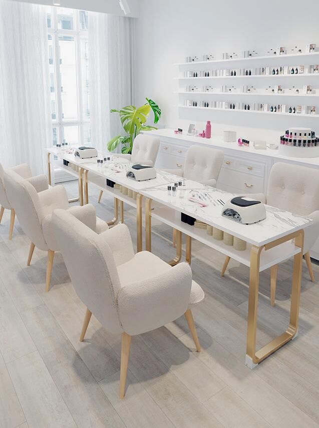 a white room with several chairs and tables in front of the window, all lined up