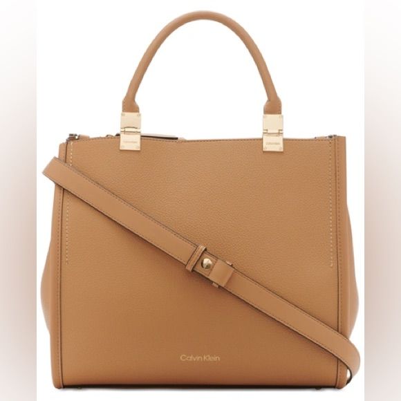 New With Tag. The Sophia Tote From Calvin Klein Has Plenty Of Room And Charm With Multiple Compartments And Faux-Leather Exterior. Large Sized Bag; 14"W X 12-3/4"H X 6-1/2"D (Width Is Measured Across The Bottom Of Handbag); 2.9 Lbs. Approx. Weight 5-1/2"L Top Handles Magnetic Snap Closure Logo Hardware Interior Zip Middle Compartment, Double Interior Slip Pocket, Interior Zip Pocket Tablet Compatible (Std. Size 8"-10") Polyurethane; Lining: Polyester Spot Clean Brown Square Satchel With Branded Hardware, Square Bags With Branded Hardware, Modern Shopping Bag With Branded Hardware, Beige Top Handle Satchel With Branded Hardware, Calvin Klein Classic Shoulder Bag, Classic Calvin Klein Leather Bags, Everyday Square Shoulder Bag With Branded Hardware, Modern Calvin Klein Leather Shoulder Bag, Classic Calvin Klein Satchel Shoulder Bag