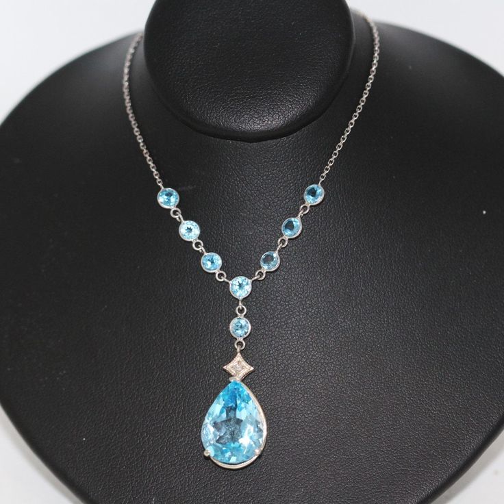 ⚓14k White Gold Pear Shaped Blue Topaz Lariat Necklace with Accented Topaz Chain Solid white gold, stamped 14k. Not filled, hollow or plated.  We sell the highest quality vintage items. Like-new condition! Free domestic shipping always! On its way to you in 1 business day.  30 day return policy!  ⚓The Details 8 round Blue Topaz Pear Shaped Blue Topaz approximate 7 ct wt 4.8 grams 16 inch chain ⚓Who We Are  We are a small, family-owned business in Plymouth, MA. Located in the heart of Main Street, Main Street Jewelry Co.'s mission is to find one-of-a-kind, unique pieces. Vintage, antiques, and rare finds are our specialty, of course other than our brand new Italian silver chains with a price that can't be beat. We thank you for supporting small businesses everywhere and checking out our sho Formal Blue Topaz Drop Necklace, Formal Blue Topaz Teardrop Pendant Necklace, Blue Topaz Teardrop Necklace For Formal Occasions, Formal Blue Topaz Briolette Necklace, Formal Blue Topaz Teardrop Necklace, Formal Teardrop Blue Topaz Necklace, Blue Topaz Pear-shaped Necklace, Blue Pear-shaped Blue Topaz Necklace, Elegant Blue Sterling Silver Lariat Necklace