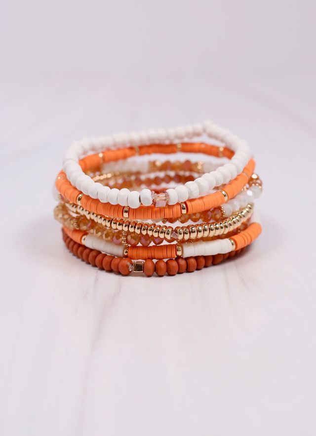 This dazzling bracelet set has seven individual strands, each with their own unique look. It has a beautiful two tone coloring design that is game day accessory ready! Stretches to fit most wrists.