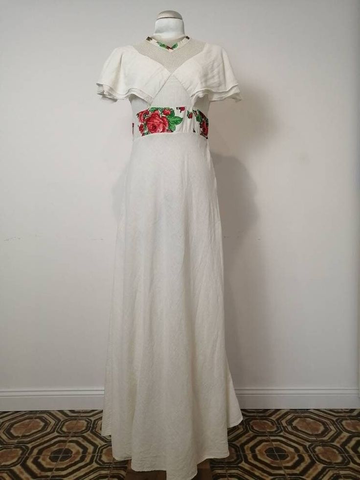 This dress is a summer dream, in very light cotton, whit volants in the bust part, and web fabric in the neckline. Flower fabric detail in the waist. There's some minor stains in the low part of the skirt, there's some picture, but the stain are so light that os not easy to see them Totally wearable Measure Bust 39 cm flat Waist 34 cm flat Total lenght 153 cm White Flowy Empire Waist Maxi Dress, Bohemian Linen Maxi Dress With Ruffles, Summer Off White Ruffled Maxi Dress, White Ruffled Empire Waist Maxi Dress, White Cotton Maxi Dress With Ruffles, Fitted Bohemian Linen Maxi Dress, Fitted Linen Bohemian Maxi Dress, Cottagecore Maxi Dress For Summer Beach, Cottagecore Summer Beach Maxi Dress