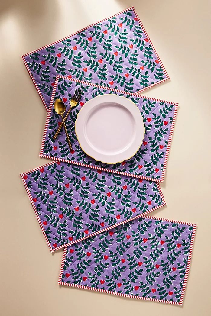 four placemats and one plate on a table