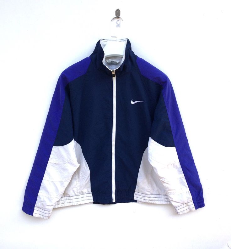 "PLEASE CONTACT TO ME WITH ANY QUESTION BEFORE BUYING.. PLEASE READ THE DESCRIPTION AND POLICIES BEFORE BUYING. TAG BRAND :- Nike SIZE ON TAG : Small ACTUAL SIZE MEASUREMENT :- ARM PIT TO ARM PIT :-23incher\" BACK COLLAR TO HEM:-23incher\" PLEASE COMPARE THE MEASUREMENT WITH YOUR GARMENT CONDITION :-8/10..A little small stain(Refer Pictures) MATERIAL : 100%Polyester COLOR:-View pic Kindly read my shipping and policies. SHIP WORLDWIDE VIA DHL GLOBAL MAIL. ⚫️Takes 14 working days to arrive. ⚫️Safe Sports White Track Jacket With Contrast Panels, White Track Jacket With Contrast Panels For Sports, Sporty Color Block Track Jacket For Streetwear, Sporty Patchwork Track Jacket For Winter, Sporty Nylon Track Jacket For Winter Sports, Blue Color Block Track Jacket For Streetwear, Blue Color Block Track Jacket, Sporty Track Jacket With Contrast Panels For Streetwear, Throwback Windbreaker For Winter Sports