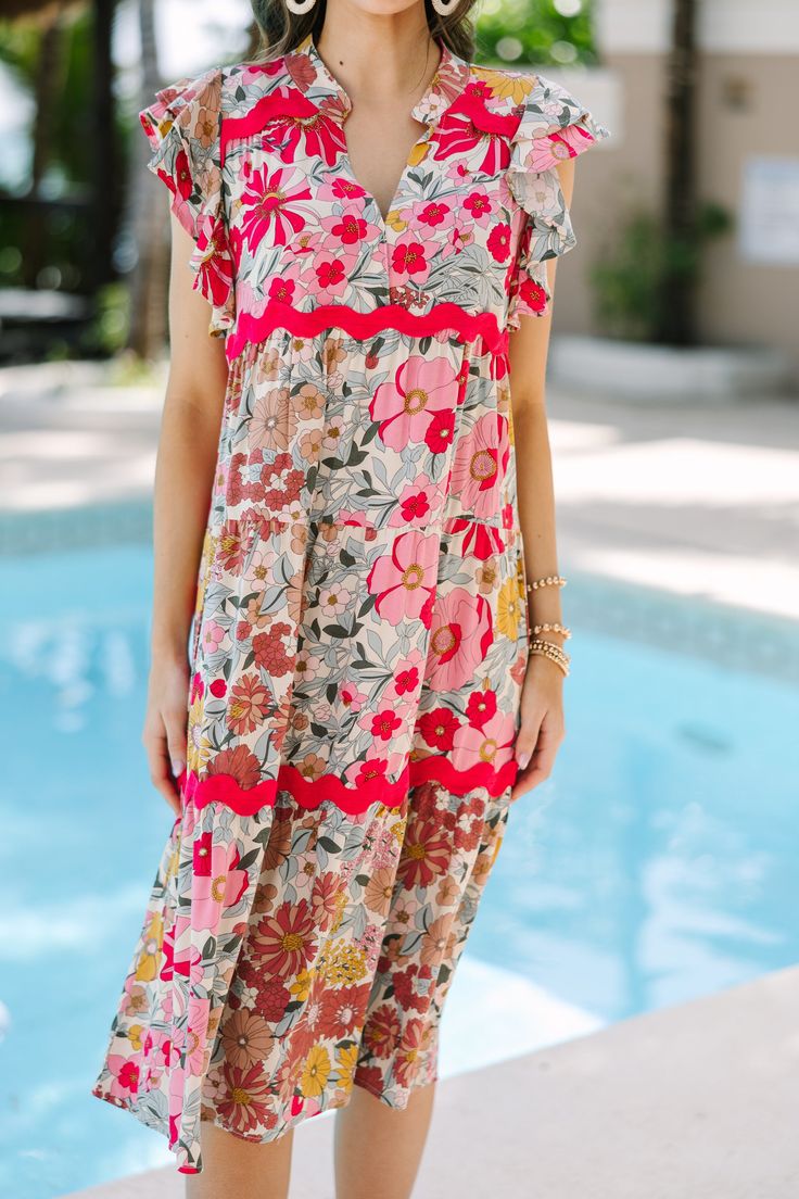 We honestly can't think of a more perfect spring/summer dress! That floral print and those hues are stunning together and we love that rickrack detailing. Rickrack is so trendy right now! V-neckline Ruffled sleeves Floral print Rickrack detailing No stretch Savannah is wearing the small. Spring Multicolor Boho Floral Dress, Spring Floral Midi Dress With Vibrant Print, Summer Multicolor Midi Dress With Floral Embroidery, Summer Multicolor Midi Dress With Ditsy Floral Print, Multicolor Ditsy Floral Print Midi Dress For Vacation, Multicolor Ditsy Floral Print Midi Dress For Summer, Spring Bohemian Pink Floral Dress, Spring Floral Dress With Vibrant Print For Brunch, Ditsy Floral Print Dress With Flutter Sleeves For Vacation