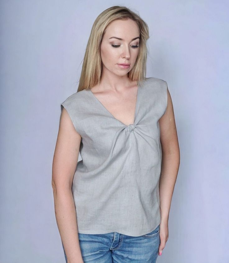 "Sleeveless linen top with twist V neck. Stylish, simple, elegant linen blouse in a relaxed fit and casual style that you can wear on many occasions. DETAILS: - 100% linen fabric (European, softened, 170-205g/m2).  - Relaxed fit  SIZING: - Please, refer to your body measurements (before purchasing) in our size chart as the picture of this listing.  🛑 SIZE CHART IS THE BODY MEASUREMENTS. - Model wearing size S. Height 5'7 (170cm). Color: Light grey. - Questions about the fit? Contact us! I highl V-neck Twist Front Top For Day Out, Twist Front V-neck Top For Day Out, Chic Linen V-neck Tank Top, Chic Linen V-neck Top, Summer V-neck Twist Front Tops, Gray V-neck Tank Top For Summer, Chic Gray V-neck Top, Feminine Linen V-neck Blouse, Summer V-neck Gray Blouse