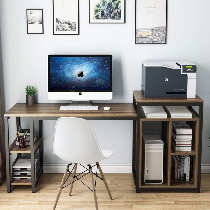 a desk with a computer and printer on it