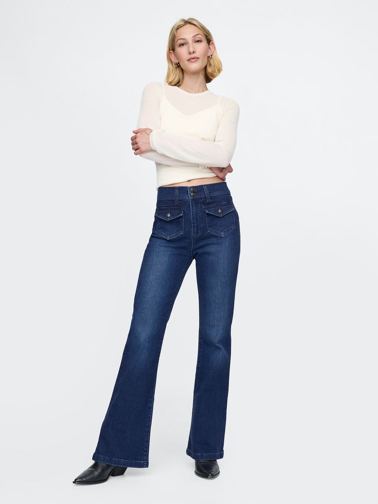 Fit: Snug & flattering through the hip & thigh with a flared leg. ​ Fabric: 86% Cotton, 13% Recycled Materials, 1% Stretch.  Stretch: High Stretch Jeans.  Innovative stretch with high recovery.  Made to move & always bounces back. ​ Rise: High Rise Jeans.  Look: A four-pocket jean in dark indigo wash.  Details: Zip fly with button-flap patch pockets at front & back.  Responsibly Made: This pair of jeans is part of our water-saving Washwell program.  Compared to conventional wash methods, Washwel Womens Lucky Jeans, Fleece Lined Jeans, Jeans Look, Water Saving, Dark Indigo, Petite Jeans, Pocket Jeans, High Rise Jeans, Petite Size