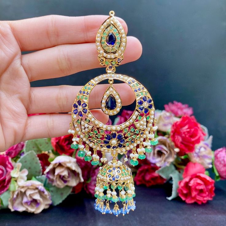 Featured is an oversized statement chandbali earrings,ideal for a bridal occassion in 22k gold set with precious emeralds, pearls and blue sapphires. The earrings measure approx 4.5inches in length and weigh 64gms. 22k Gold Jewelry Necklaces, 22k Gold Jewelry, Chandbali Earrings, Pearl Necklace Set, Gold Jewelry Necklace, Emerald Necklace, Jhumka Earrings, Gold Bangle Bracelet, Gold Set