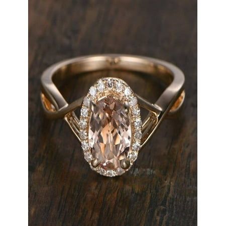 an engagement ring with a large brown diamond in the center and two smaller diamonds around it