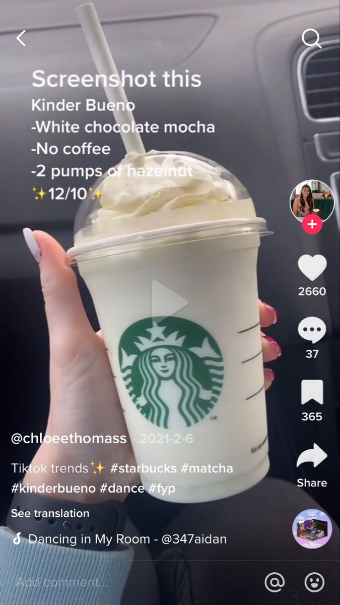 someone holding up a starbucks cup with whipped cream in it and texting on the screen