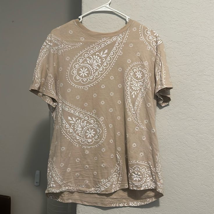 This Is A Nearly Unused Shirt From Rue21 Featuring A Paisley Design In White And Light Beige. Is A Size Medium. Trendy Cotton Bandana Print Tops, Trendy Cotton Tops With Bandana Print, Cotton Paisley Print Patterned Tops, Spring Cotton Paisley Print Tops, Casual Bandana Print Tops For Spring, Spring Cotton Tops With Paisley Print, Casual White Shirt With Paisley Print, Casual Shirt With Paisley Print And Relaxed Fit, Summer Bandana Print Short Sleeve Tops