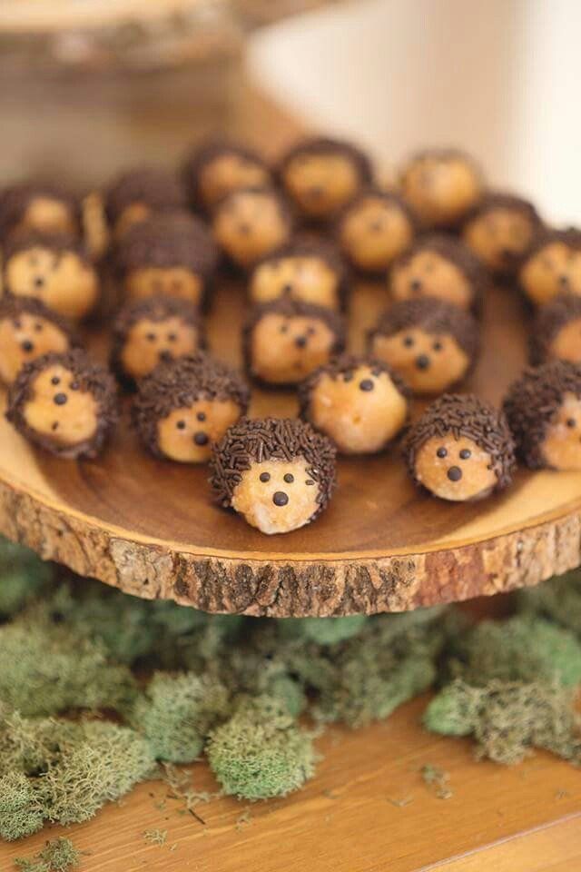 some little brown bears sitting on top of a wooden plate