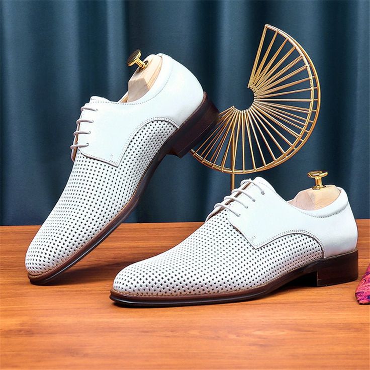 Elevate your style with the LaceLuxe Pointed Toe Wedding Dress Shoes, the epitome of elegance and sophistication. Crafted with genuine cow leather and featuring a solid pattern and pointed toe shape, these brogue shoes make a statement wherever you go. Not only do they look stunning, but they also prioritize comfort with a full grain leather insole and pigskin lining. Dance the night away with the secure lace-up closure and confidently navigate any surface with the durable rubber outsole. Whether you're walking down the aisle or attending a special event, make a lasting impression with these shoes that are sure to turn heads and leave a lasting impression. Elegant White Wingtip Lace-up Shoes, White Pointed Toe Oxfords For Business, Formal White Pointed Toe Oxfords, White Pointed Toe Oxfords For Formal Occasions, White Pointed Toe Lace-up Shoes For Formal Occasions, White Brogue Oxford Shoes With Pointed Toe, White Dress Shoes With Brogue Detailing For Spring, Fitted White Dress Shoes With Brogue Detailing, Fitted Wingtip Oxfords For Wedding