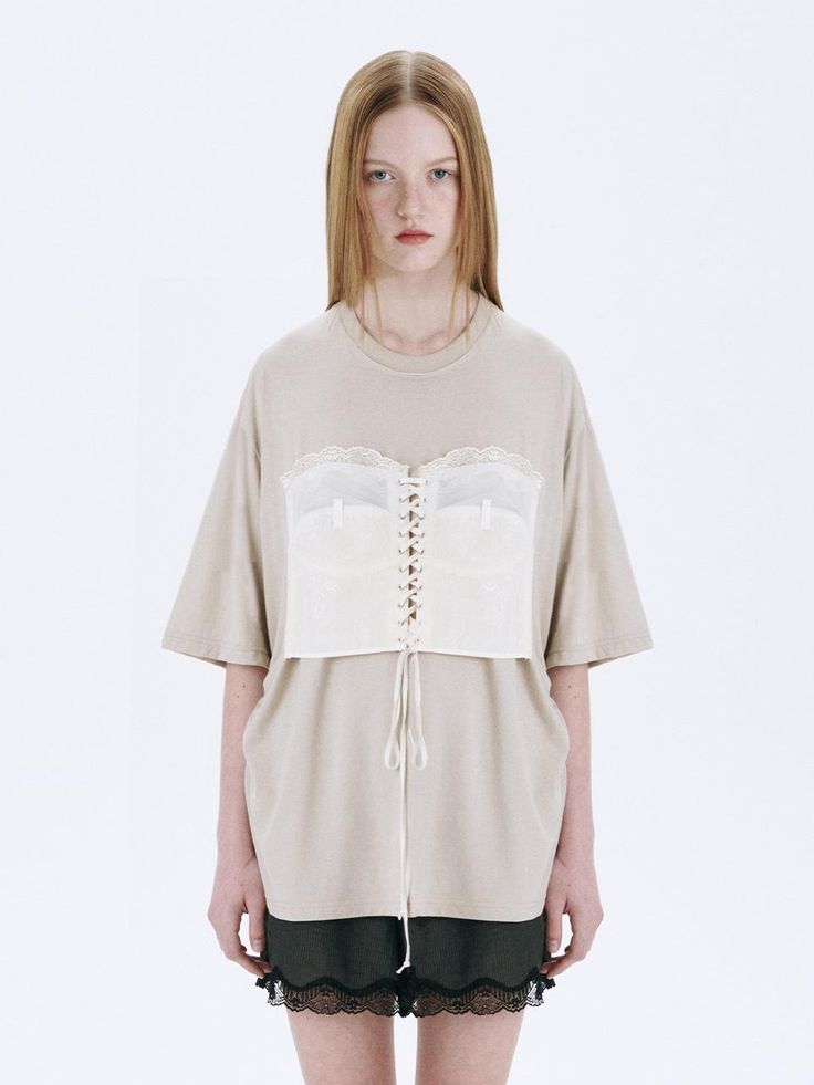 This is a trendy and casual top by MARGESHERWOOD that is made out of high quality and sturdy material. With distinctive mood of the design and comfortable wear, you can style it for your casual daily outfit.- Relaxed oversized silhouette- Corset detail with eyelets and strings- Cotton 100% pigment fabric Chic Oversized Tops For Loungewear, Spring Oversized Beige T-shirt, Oversized Short Sleeve Knit Top For Fall, Oversized Knit Top With Short Sleeves For Fall, Chic Oversized T-shirt For Fall, Beige Short Sleeve Blouse For Layering, Oversized Beige T-shirt For Summer, Oversized Cotton Knit Top With Short Sleeves, Oversized Cotton Short Sleeve Knit Top