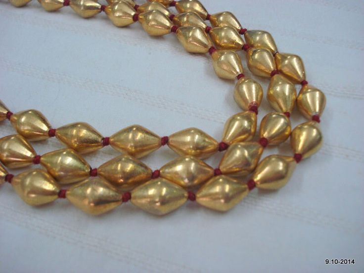 22kt gold beads necklace chain mala from rajasthan india, great handmade design good for jewelry collection. Note - There is wax inside the beads. Beads are filled with wax inside. Please check pictures carefully for more details. Here I charge only for 66 gold beads. You can re-string with your own style. Length - Free size can be adjust by back thread knot. Size of each bead (approx) - 13/8 mm Gross weight (approx) - 80 grams  Material - 22kt yellow gold beads inside wax. Note - All the items Gold 22k Kundan Necklace For Puja, 22k Gold Beads Jewelry For Festivals, Gold Kundan Necklace For Puja In 22k Gold, 22k Gold Beaded Jewelry For Festivals, Handmade Temple Jewelry Beaded Necklaces For Festivals, Gold Kundan Necklace For Festive Occasion, Festive Gold Kundan Necklace In Temple Style, Gold Bollywood Temple Necklace As Gift, Bollywood Style Gold Temple Necklace As Gift