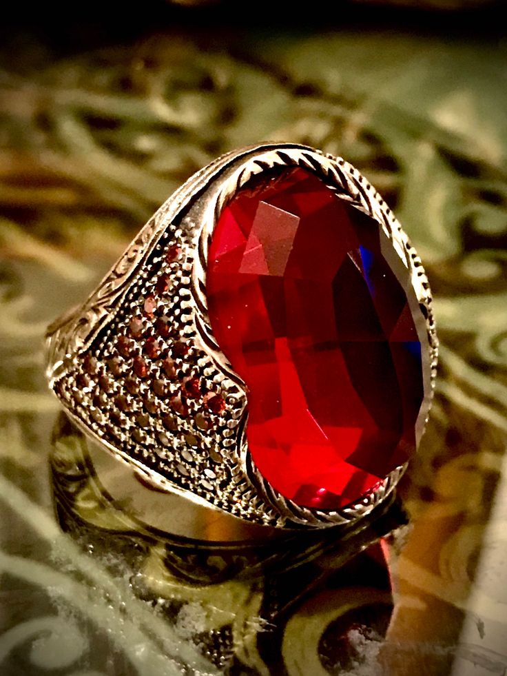 "Engraved Ring, Red Stones Ring, Jewelry Men Ring, Christmas gift, New year gift, Gift For Him, Gift For Men, Red Color Men Ring, Red color steals the hearts of many of us due to its one-of-a-kind look that makes it stand out from all other colors. No matter where it appears, it looks like red roses and feels like love. A brilliant jewelry piece when featured in red, blows the minds of admirers. The most awaited trendy jewelry is here and the collection features a \"925 Sterling Silver Ring with Jewelry Men Ring, Beryl Ring, Red Stone Ring, Red Stones, Engraved Ring, Jewelry Men, Men Ring, New Year Gift, Men's Jewelry Rings