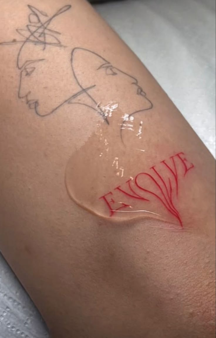 the word « evolve » in red tattoo anchor Dripping Word Tattoo, Evolve Tattoo Words, Red Art Tattoo, Cute Red Ink Tattoos, Red Tattoo Faded, Cool Red Tattoos, Aesthetic Red Tattoo, Red Swirl Tattoo, Dripping Tattoo Ideas