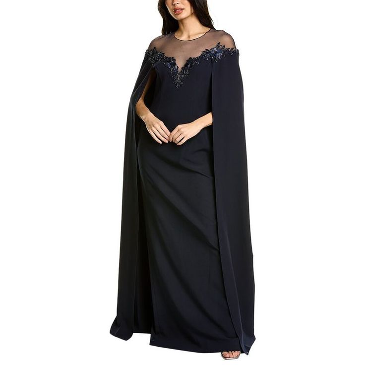 About The Brand: Gowns And Cocktails For That Special Night. Cape Gown In Navy With Crepe Design, Tulle Illusion Neckline, And Beaded Trim Approximately 62in From Shoulder To Hem Model Is 5'9.5 And Is Wearing A Size 4. Measurements May Vary Slightly By Size. Center Back Zipper With Hook-And-Eye Closure Keyhole Button Closure Shell: 87% Polyester, 13% Spandex Lining: 100% Polyester Dry Clean Only Imported Elegant Blue Maxi Dress With Cape Sleeves, Blue Maxi Dress With Cape Sleeves For Evening, Evening Sheer Dress With Cape Sleeves, Evening Dress With Sheer Cape Sleeves, Mother Of The Bride Evening Dress With Cape Sleeves, Evening Mother Of The Bride Dress With Cape Sleeves, Formal Mother Of The Bride Dress With Cape Sleeves, Floor-length Evening Gown With Sheer Sleeves, Floor-length Gown With Sheer Sleeves For Evening