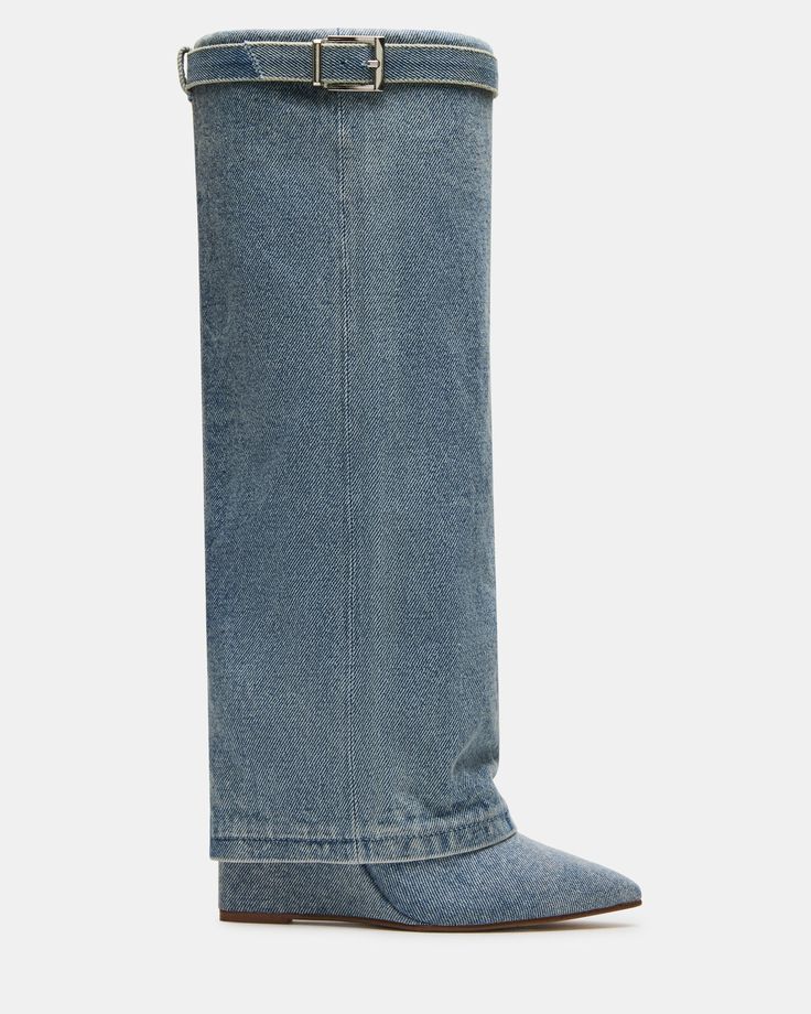 Introducing the CORENNE boot, the perfect combination of 90s style and modern comfort. Featuring a fold over design, pointed toe, and buckle detail, these knee high boots are sure to make a statement. 3.75 inch heel height Size 6 measurements: 15.75 inch shaft circumference, 16.25 inch shaft height Size 8 measurements: 16.5 inch shaft circumference, 16.75 inch shaft height Size 10 measurements: 17.25 inch shaft circumference, 17.25 inch shaft height Textile upper material Textile lining Syntheti Blue Jean Boots, Jean Boots, Girl Boots, Denim Boots, 90s Style, Girls Boots, Big Girl, Fold Over, Blue Jean