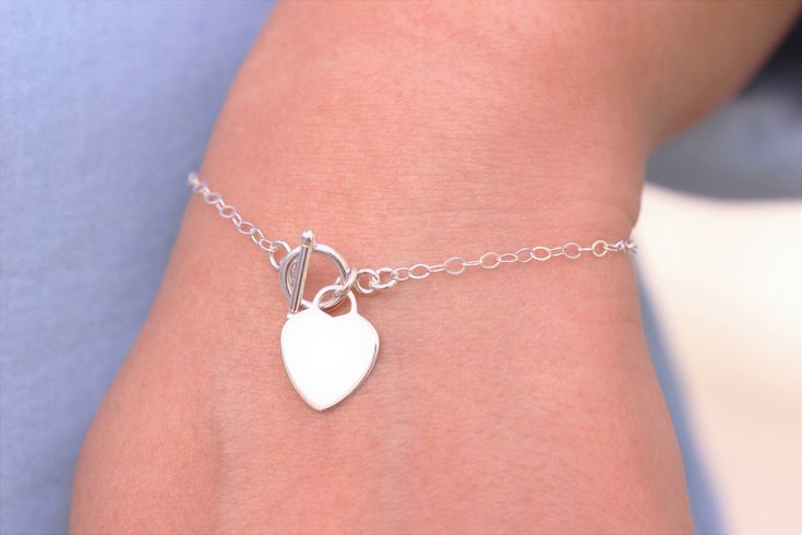 Toggle clasp bracelet - Toggle heart bracelet - Toggle Bracelet - Toggle Jewelry - Toggle clasp jewelry - Toggle heart lock bracelet by rainbowearring1 on Etsy https://www.etsy.com/listing/586652588/toggle-clasp-bracelet-toggle-heart Charm Bracelet With Toggle Clasp As A Gift, Everyday Sterling Silver Bracelet With Toggle Clasp, Everyday Charm Bracelet With Toggle Clasp, Elegant Heart Bracelet With Toggle Clasp For Gift, Heart Charm Bracelet With Toggle Clasp For Gift, Valentine's Day Gift Bracelet With Toggle Clasp, Heart Shaped Bracelet With Toggle Clasp As Gift, Heart Shaped Toggle Clasp Bracelet For Gift, Valentine's Day Gift Heart Bracelet With Toggle Clasp