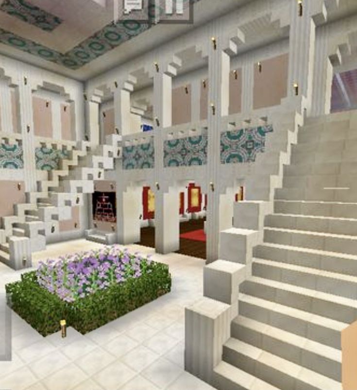 the inside of a building with stairs and flowers