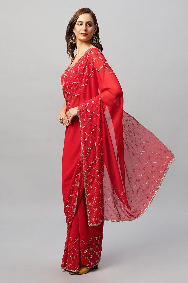 The exquisite Ava Luxe Red Pure Georgette One Minute Saree is elegance wrapped in six yards. Made to elevate your grace, this translucent and lightweight easy-to-drape saree is your go-to fashion. Its delicate and subtle sheen with diamond work is the epitome of elegance. About this Product Saree: Saree Color: Red Saree Fabric: Viscose Georgette Type of Work: Gold Cutdana Diamonds Drape Style: Choose the drape style while order: Standard Open, Pleated or Gujarati Saree length: 5.5 meters Pettico Elegant Red Pre-draped Saree For Festive Occasions, Red Pre-draped Saree With Cutdana For Celebrations, Red Pre-draped Saree For Eid Wedding, Traditional Georgette Pre-draped Saree For Celebration, Pre-draped Georgette Saree For Celebration, Red Pre-draped Saree With Pallu For Eid, Anarkali Style Georgette Pre-draped Saree For Celebration, Anarkali Style Pre-draped Georgette Saree For Celebration, Bollywood Style Red Pre-draped Saree With Self Design