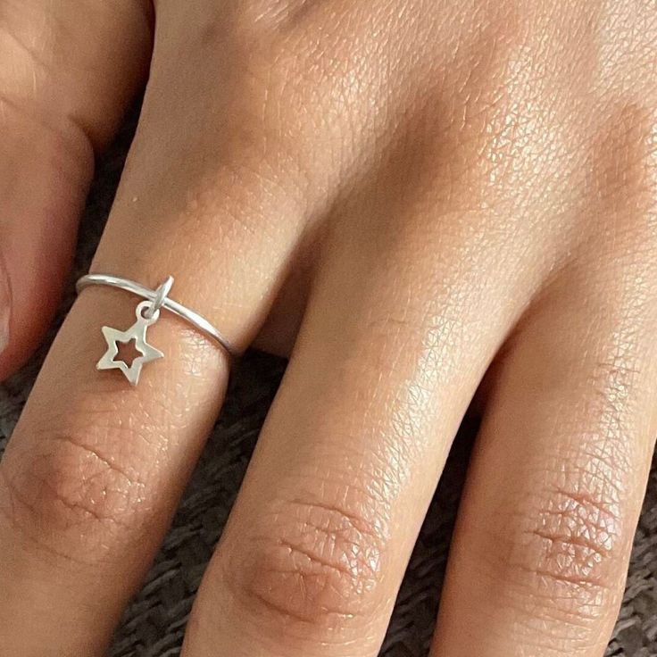 🌷This beautiful dainty handmade charm ring, will make a lovely Christmas gift for someone special. It can also be worn as a fidget ring, as the gorgeous little star charm can move around the ring band. This lovely ring looks beautiful on its own, or stacked with other rings. 🌷Your ring will be made to order in the size of your choice, so please choose your ring size from the drop down ring chart. 🌷Ring dimensions: 925 sterling silver 1.2mm gauge Star charm: 6mm 🌷Your ring will arrive gift wr Silver Star Ring, Ring Chart, Silversmithing Jewelry, Charm Ring, Fidget Rings, Charm Rings, Handmade Rings, Handmade Charms, Star Ring