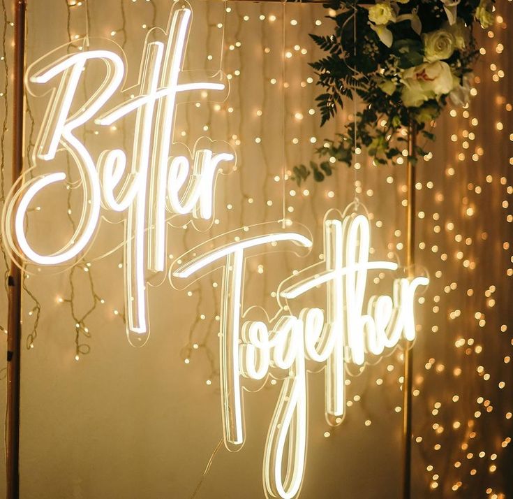 a lighted sign that says better together